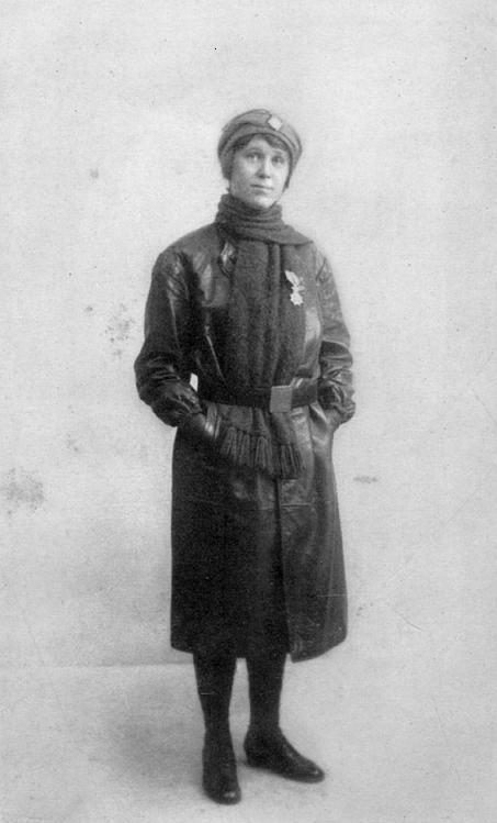 HILDA in her motor-ambulance uniform wearing the "Order of Leopold II," conferred on her by King Albert in person.